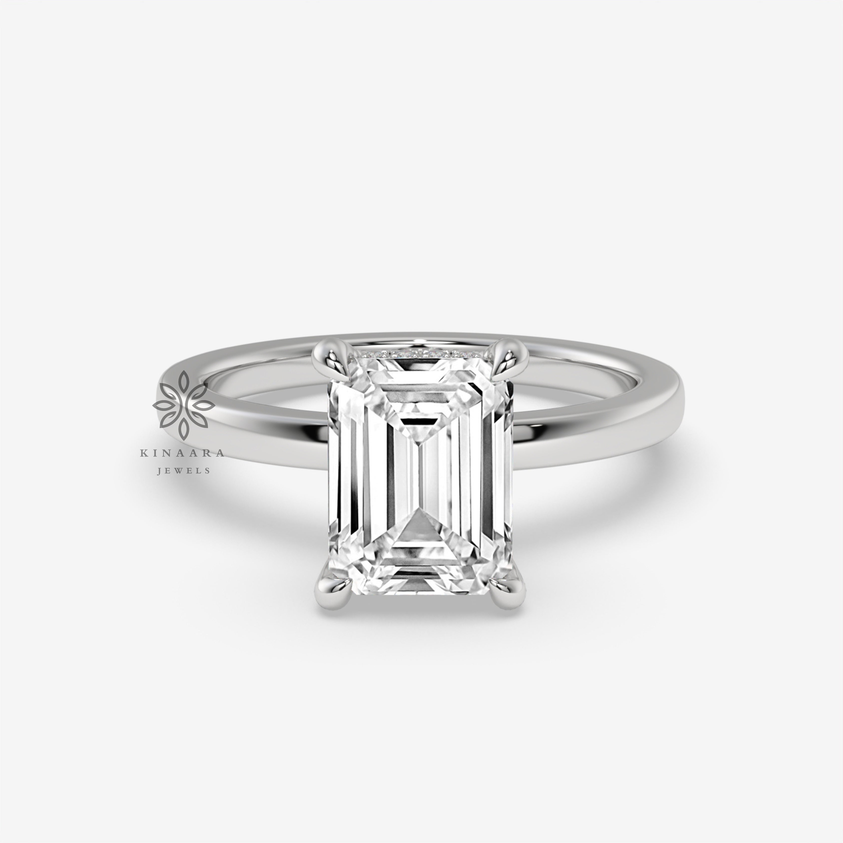 emerald solitaire engagement ring