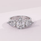 Custom pear moissanite diamond ring enhancer wrap for a personalized bridal set