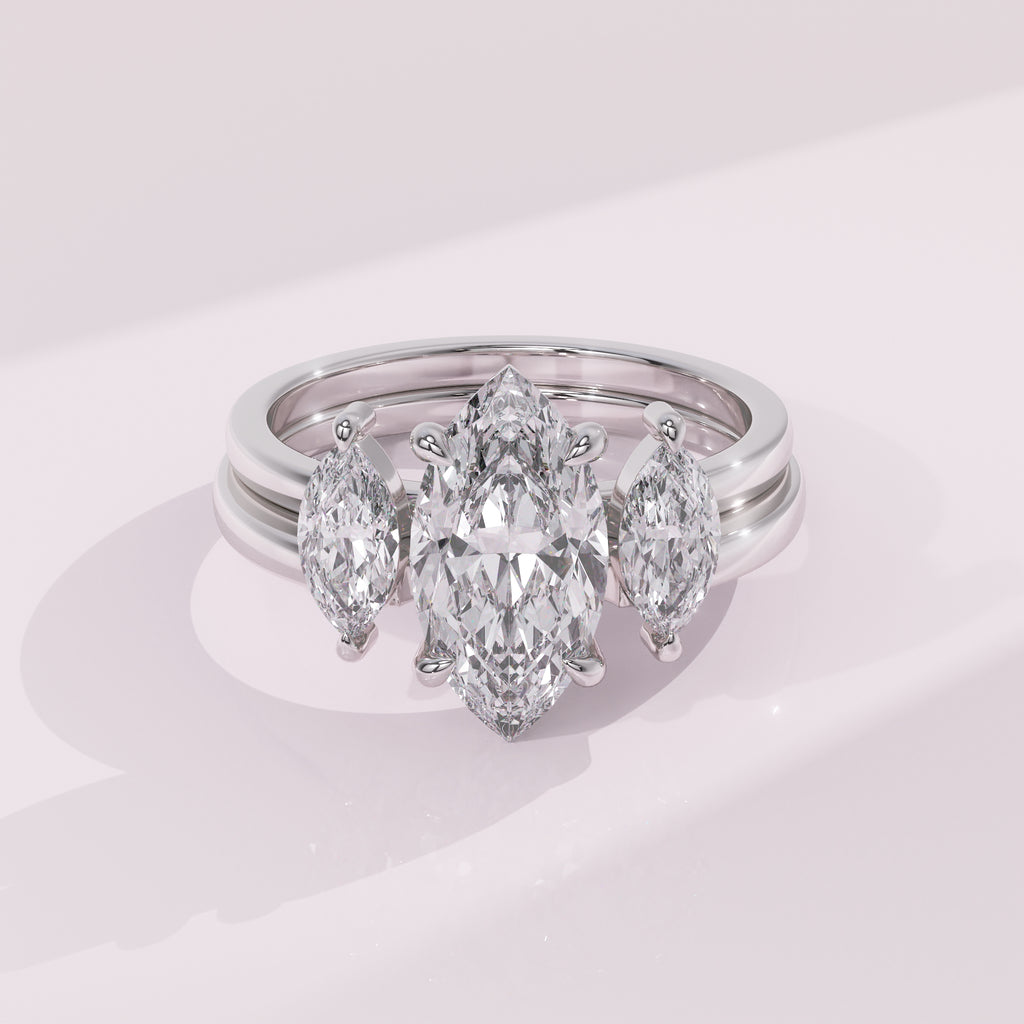 Double marquise diamond guard band with symmetrical marquise stones for a modern bridal look.