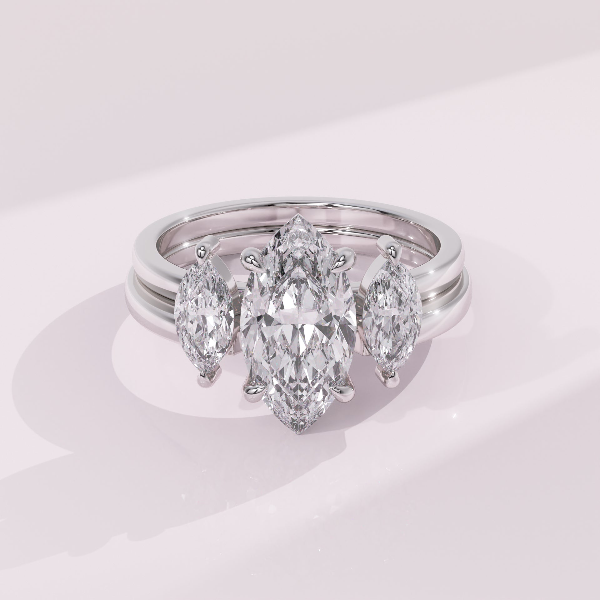 Double marquise diamond guard band with symmetrical marquise stones for a modern bridal look.