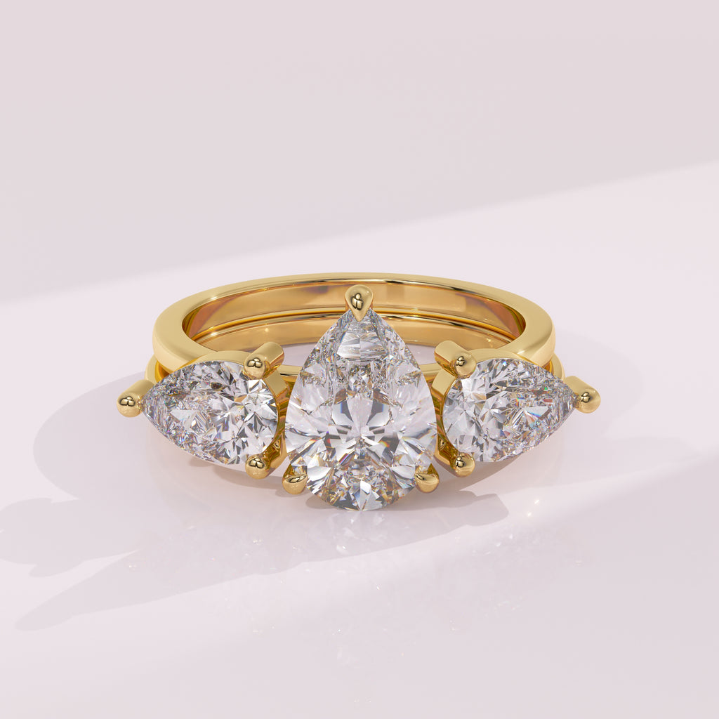 Double pear diamond wedding ring guard band with matching pear cut stones