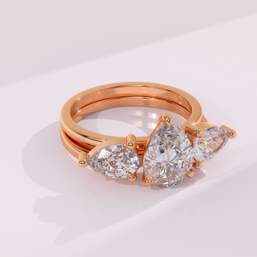 Handcrafted twin pear moissanite wedding ring enhancer with an open contour design