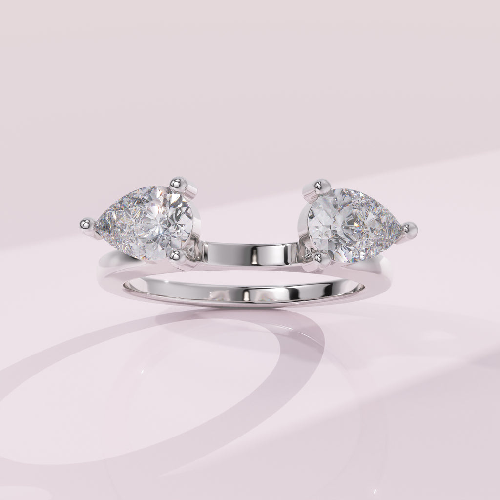 Pear cut moissanite open wrap band designed to frame a solitaire engagement ring