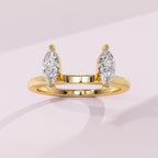 Twin marquise diamond ring guard crafted to enhance a solitaire engagement ring with a balanced design.