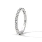 dainty round moissanite gold wedding band in silver