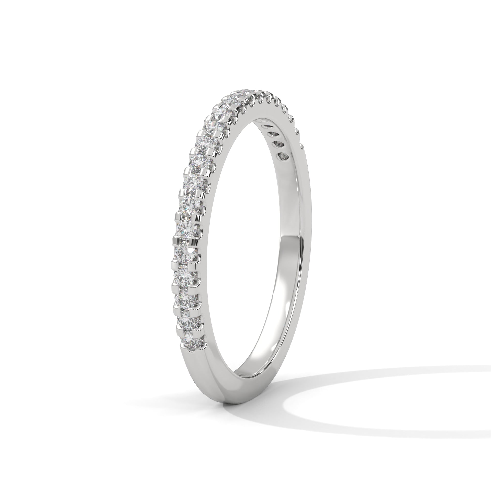 dainty round moissanite gold wedding band in silver
