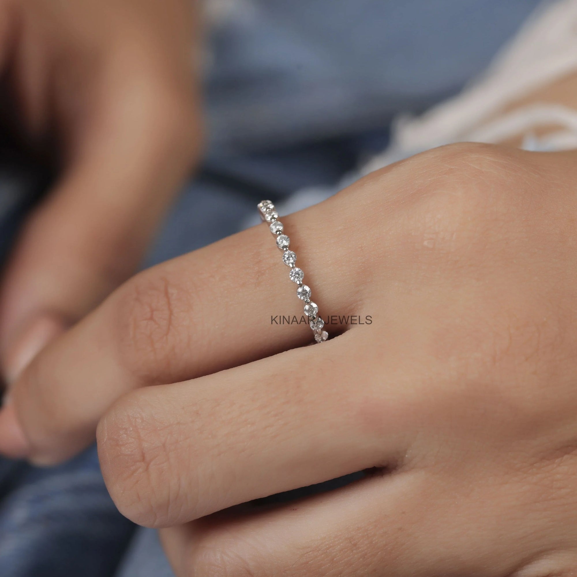 floating bubble single prong moissanite eternity band in white gold