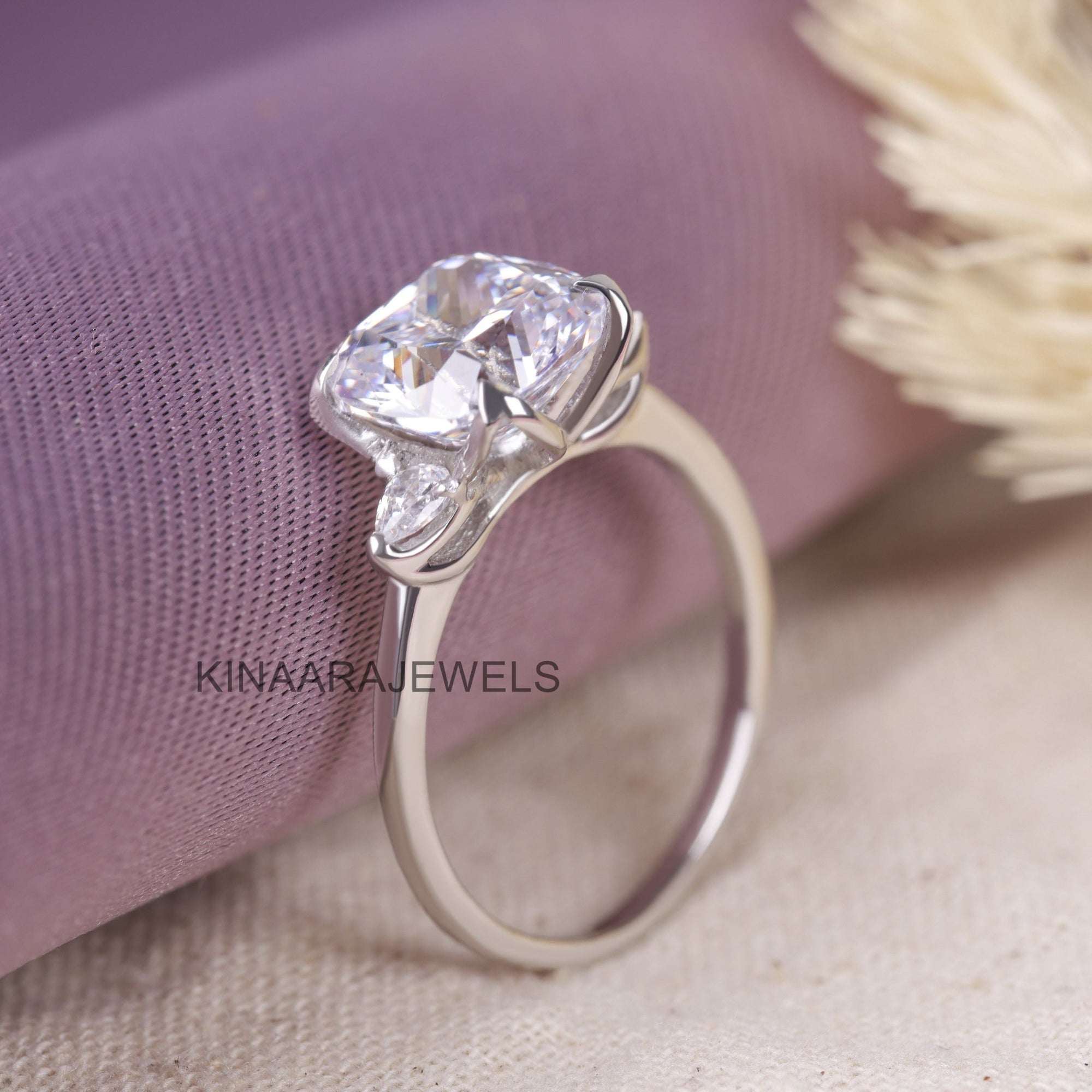 three stone cushion cut diamond ring