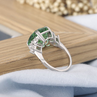 green emerald engagement rings