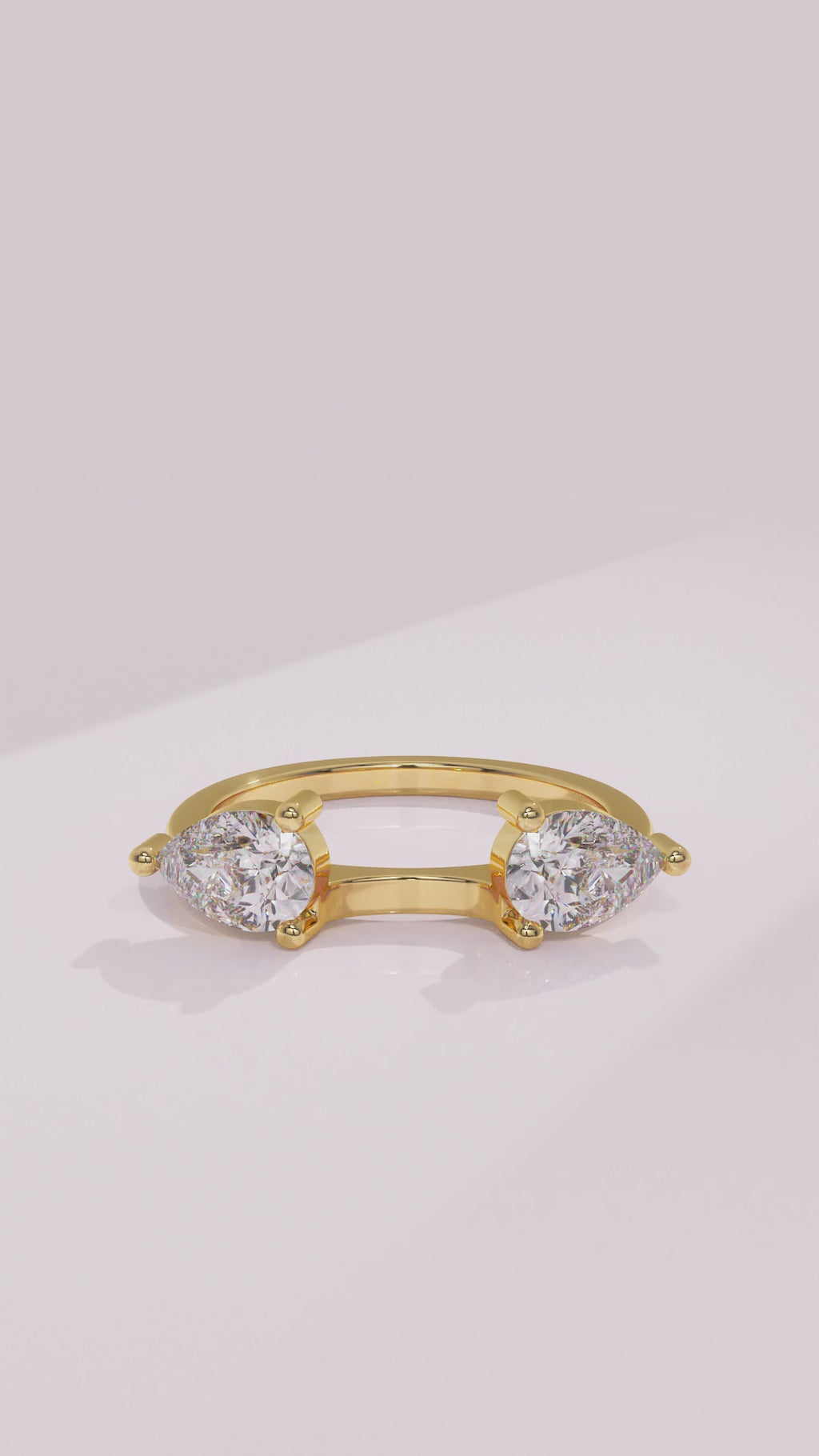 Pear diamond wrap wedding ring enhancer framing a solitaire engagement ring