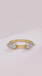 Pear diamond wrap wedding ring enhancer framing a solitaire engagement ring