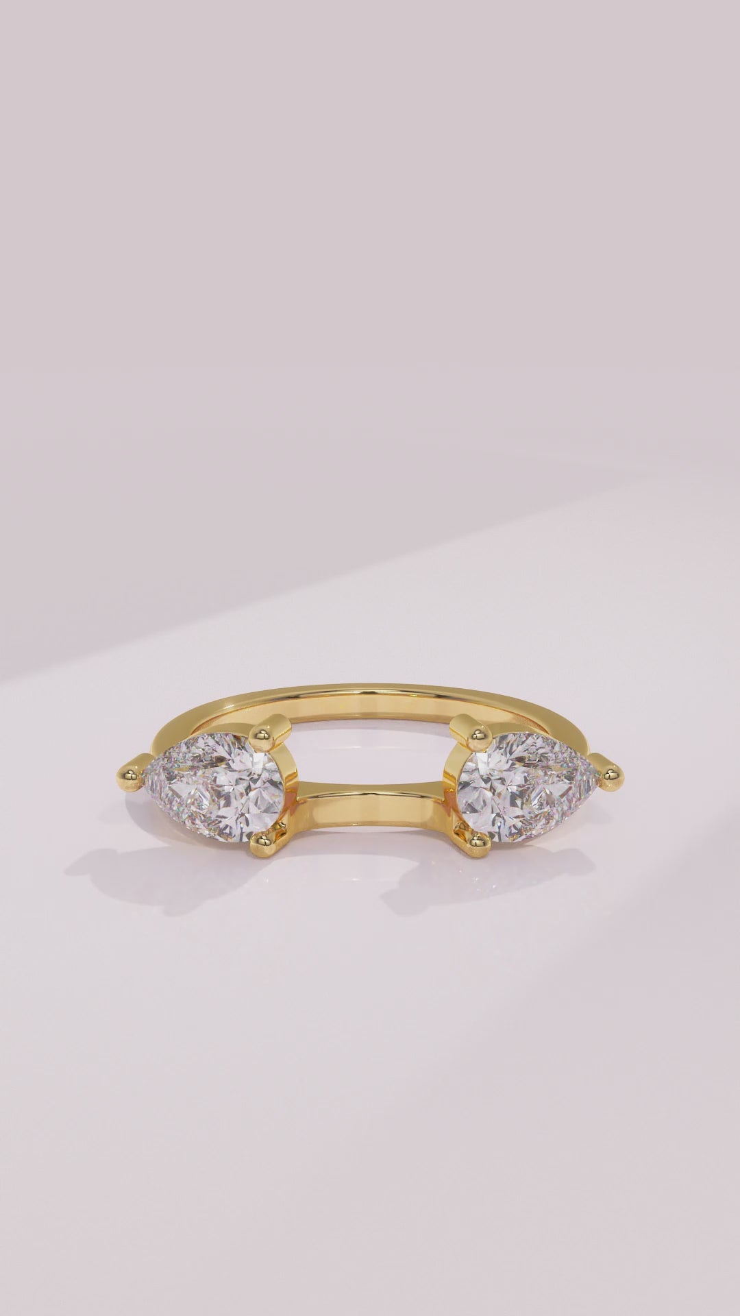 Pear diamond wrap wedding ring enhancer framing a solitaire engagement ring