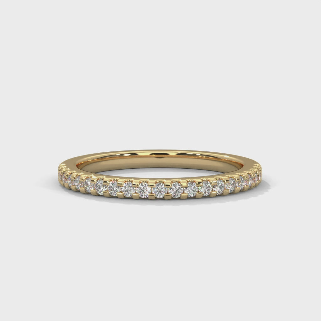dainty round moissanite gold wedding band in 14K Gold

