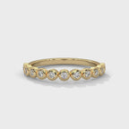Round Cut Mossanite Bezel Set Eternity Wedding Band in 10K Gold