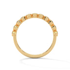 round cut diamond bezel set eternity wedding band in 18K Gold